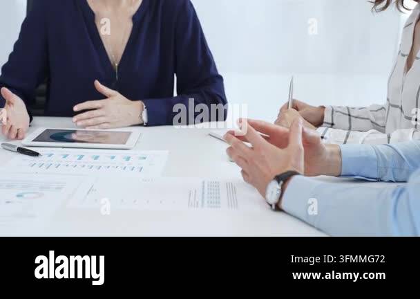 Business team analyzing financial data using charts, graphs, and ...