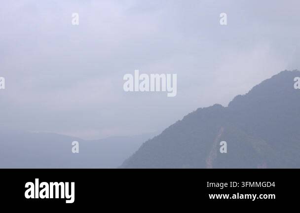 Scenic morning view of a steep mountain ridge partially covered in soft ...