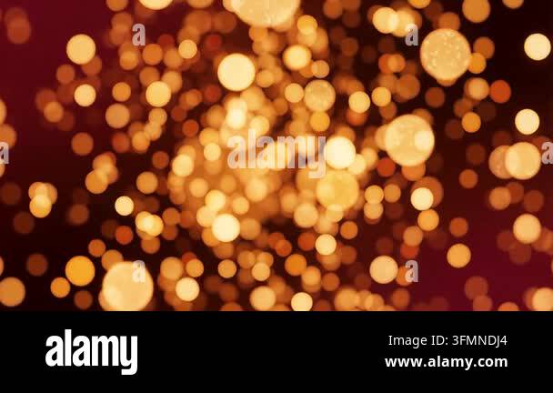 Abstract background featuring glowing golden bokeh lights shimmering ...
