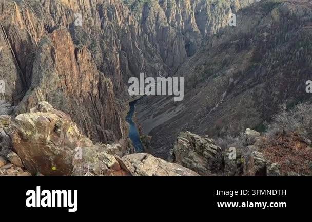 Aerial view of a narrow river flowing through a deep rocky canyon Stock ...