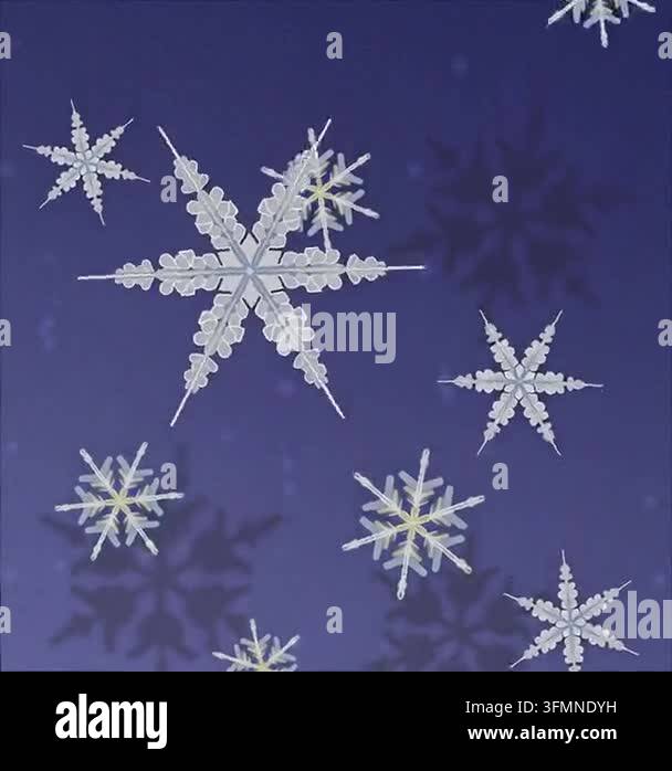 Snowflakes falling against dark blue background Stock Video Footage - Alamy