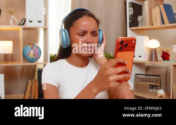 African American young woman on home table learns foreign language ...