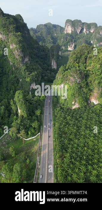 Aerial view of picturesque landscape with winding road among karst ...