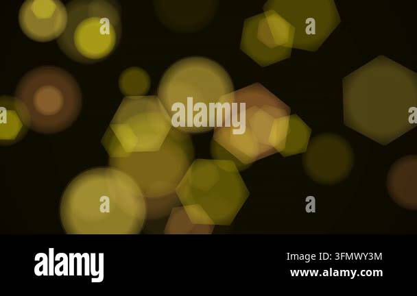 Vintage gold bokeh light with elegant warm glowing particles on dark ...