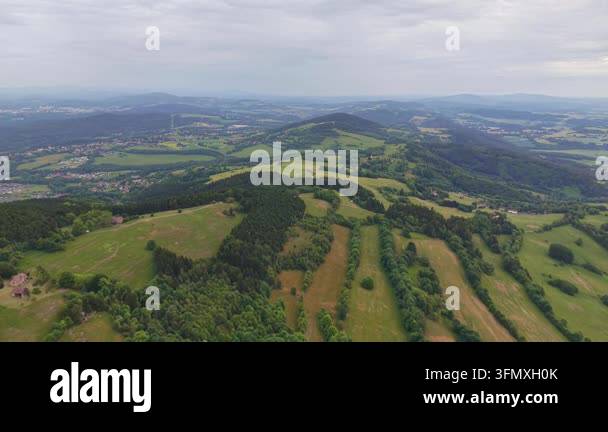 aerial drone view of a beautiful green valley and mountains in the ...