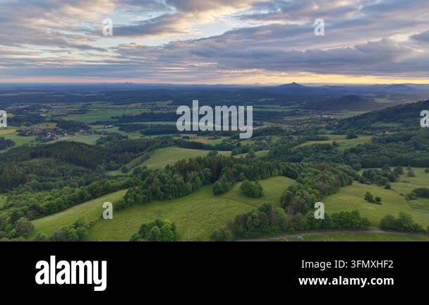 a vertical shot of a beautiful landscape with a green forest Stock ...