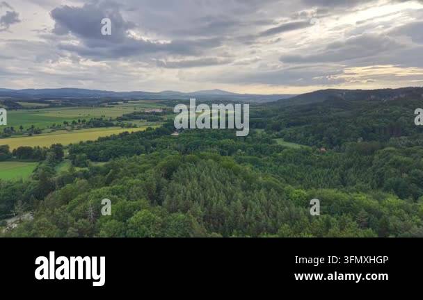 a aerial view of a green forest and a beautiful landscape Stock Video ...