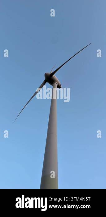 wind turbine on the blue sky background Stock Video Footage - Alamy