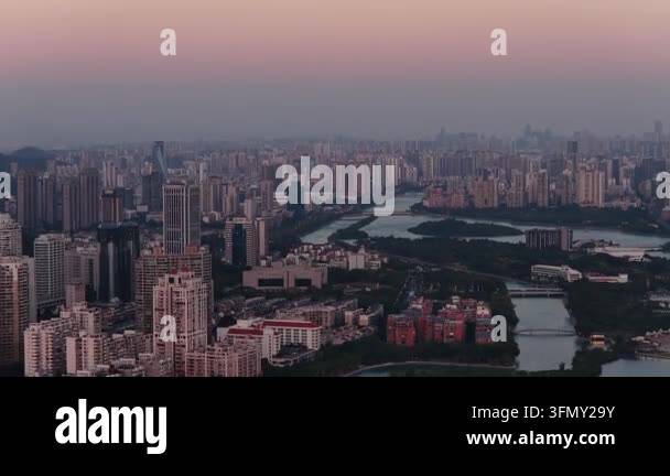 An expansive aerial shot reveals a sprawling city of countless high ...