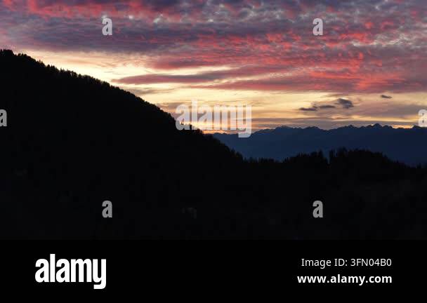 Dramatic sunset sky with vibrant pink and orange clouds over ...