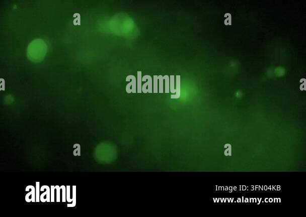 abstract green background, grainy texture and glowing particles Stock ...