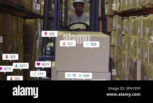 Operator driving forklift toward camera in warehouse aisle, causing ...