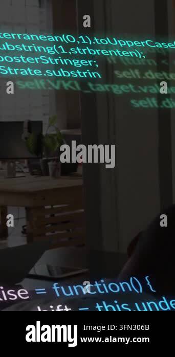 Vertical video: Seated man working on laptop debugging code, tech text ...
