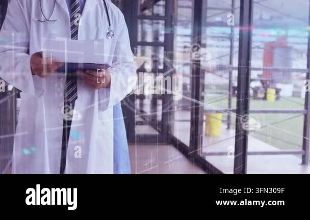 Animation of network of connections with icons over caucasian doctor ...