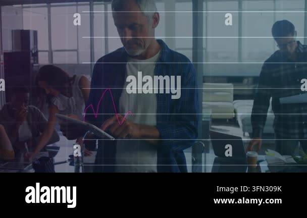 Animation of data processing over caucasian businessman using tablet ...
