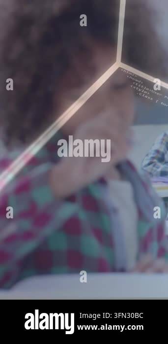 Vertical video: Pupil writing with pen at desk, pausing to think and ...