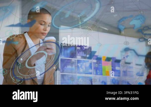 Woman lowering cup and shifting gaze toward laptop, moving to work ...