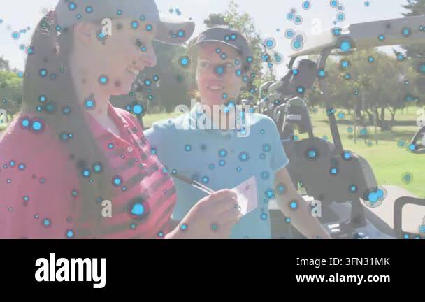 Two golfers checking scorecard and writing score with blue spots ...