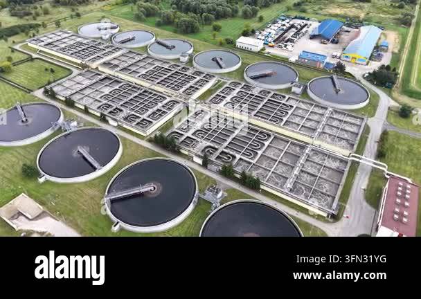 Aerial view of sewage treatment facilities showcasing multiple circular ...