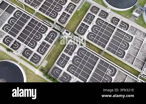 Aerial view of sewage treatment facilities showcasing multiple circular ...