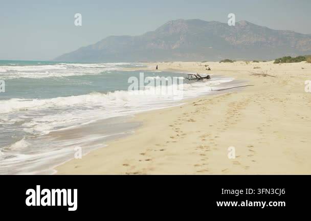 Wide view of Patara Beach in Turkey with sandy shoreline, dunes ...