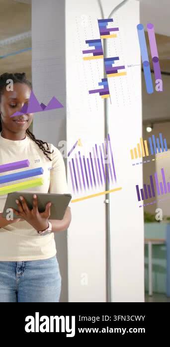 Vertical video: Woman tapping tablet in office causing moving charts ...