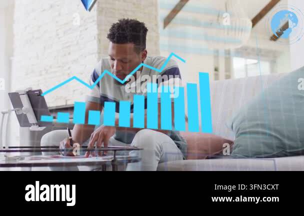 Man leaning looking at tablet writing on glass table for analytics with ...