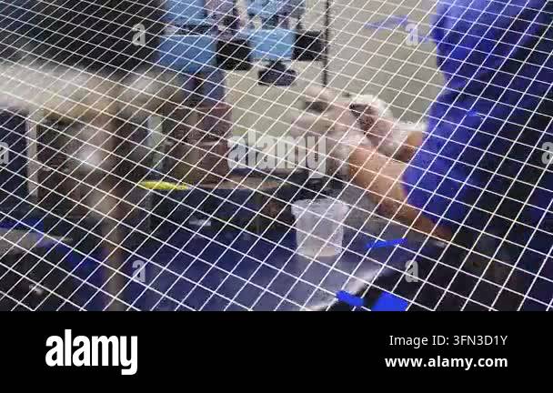 Lab technician entering with probe, manipulating red-capped vial for ...