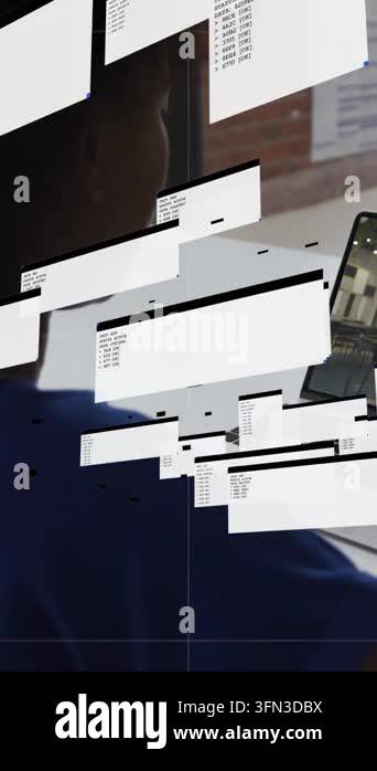 Vertical video: Woman at laptop, on start windows cascading, obscuring ...