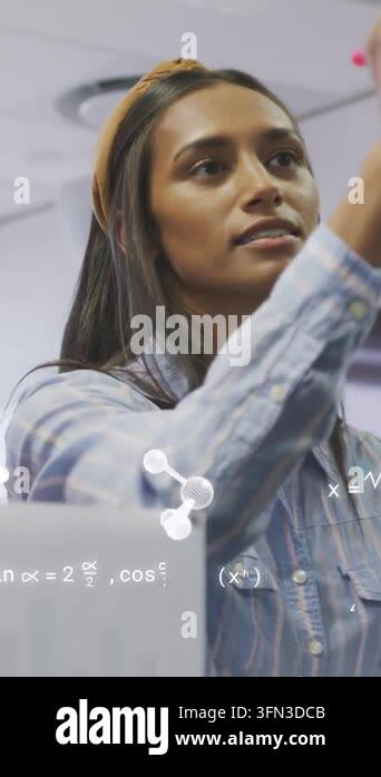 Vertical video: Woman writing in lab pink marker making math molecular ...