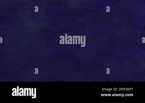 Flowing purple particle wave forming an abstract digital surface on a ...