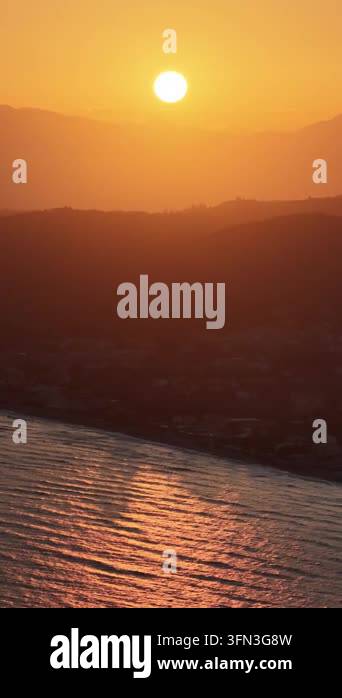 Aerial view of stunning golden sunset over Roda Beach in North Corfu ...