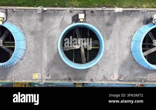Aerial view of an industrial ventilation system with large blue fans on ...