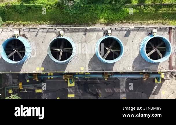 Aerial view of an industrial ventilation system with large blue fans on ...