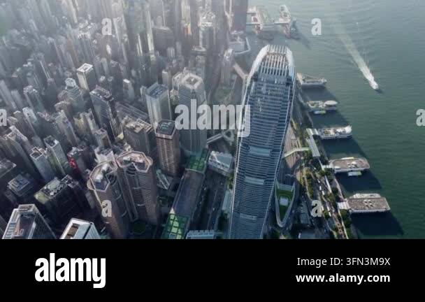 Aerial view of Hong Kong skyscrapers and Victoria Harbour with boats ...