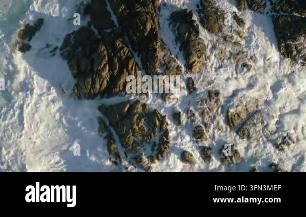 sea waves crashing against rocky shore Stock Video Footage - Alamy