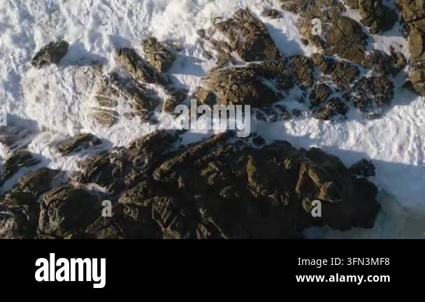 sea waves crashing against rocky shore Stock Video Footage - Alamy