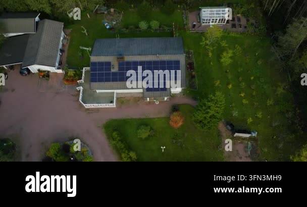 aerial view of house with solar panels on roof Stock Video Footage - Alamy