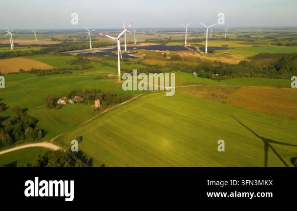 Aerial view of solar panels and wind turbines in field Stock Video ...