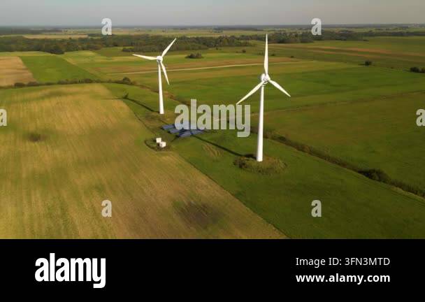 Aerial view of solar panels and wind turbines in field Stock Video ...