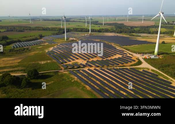 Aerial view of solar panels and wind turbines in field Stock Video ...