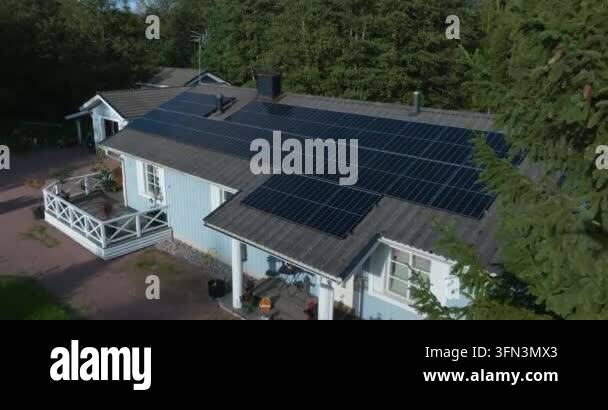 Aerial view of house with solar panels on roof Stock Video Footage - Alamy
