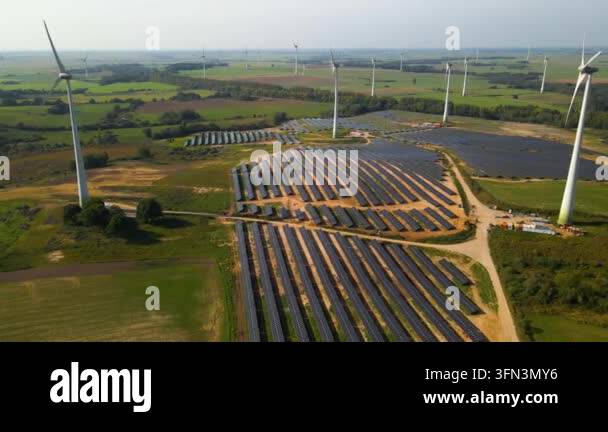 Aerial view of solar panels and wind turbines in field Stock Video ...