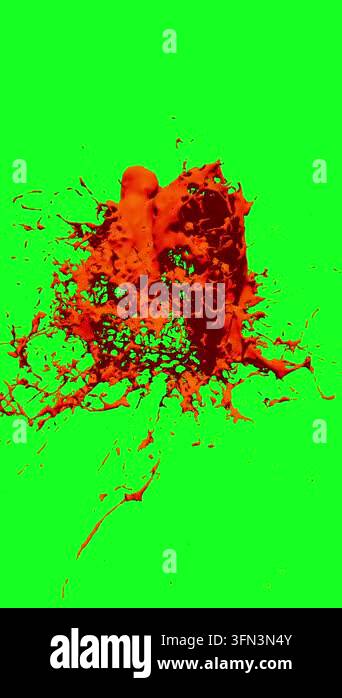 Abstract explosion of red paint splashing against a vibrant green ...