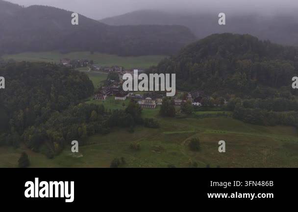 High angle aerial view of a misty mountain valley Stock Video Footage ...