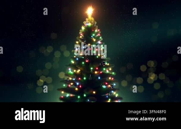 Decorated Christmas tree with colorful lights and a glowing star Stock ...