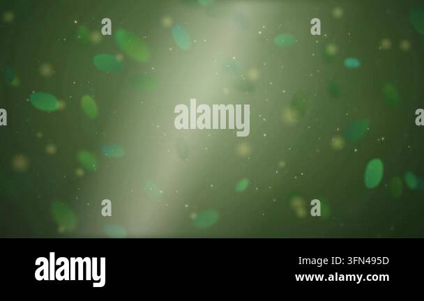 Abstract background with floating green and yellow particles and bokeh ...