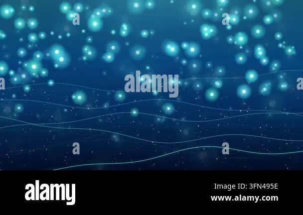 Glowing particles floating in deep blue water Stock Video Footage - Alamy