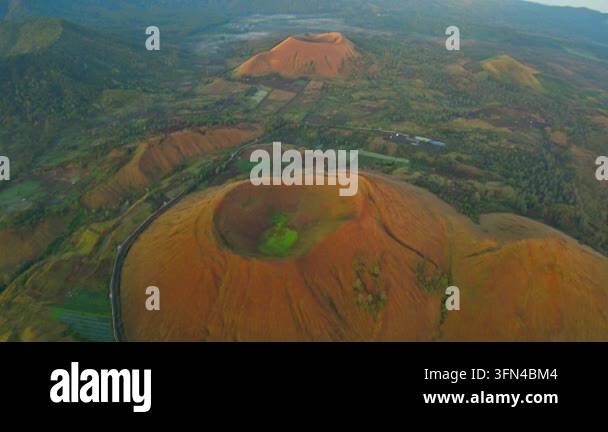 Volcantic Rocks Aerial view of volcanic craters in a lush green landscape Stock Video ...