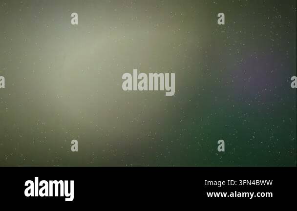 Abstract background with small white particles floating and subtle lens ...